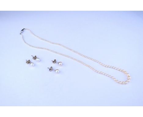 A single strand fine pearl necklace and two pairs of pearl stud earrings 