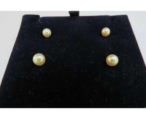 Two pairs of cultured pearl stud earrings 