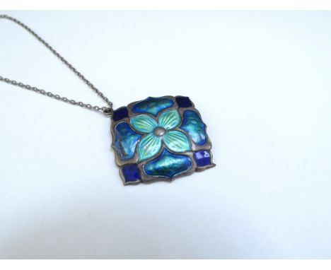 An Art Nouveau silver enamelled pendant in greens and blues 2.5cm x 2.5cm hung on a chain, clasp broken 