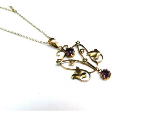 A gold chain stamped 9kt, 40cm long hung with a gold pendant with seed pearl and amethyst coloured stone, stamped 9ct, 2.3g 