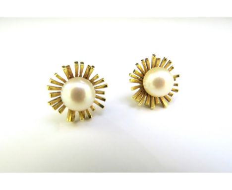 A pair of 14ct gold earrings with a pearl centre, 7.2g 
