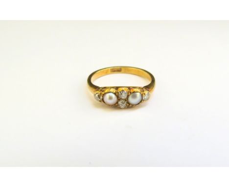 A pearl and diamond ring, stamped 18ct. Size K, 2.5g 