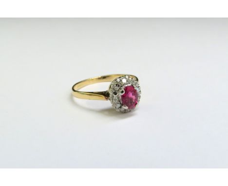 A ruby and diamond cluster ring, marks rubbed. Size L, 2.1g 