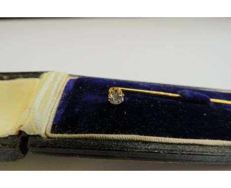 A diamond set stick pin 0.15ct approx, cased 