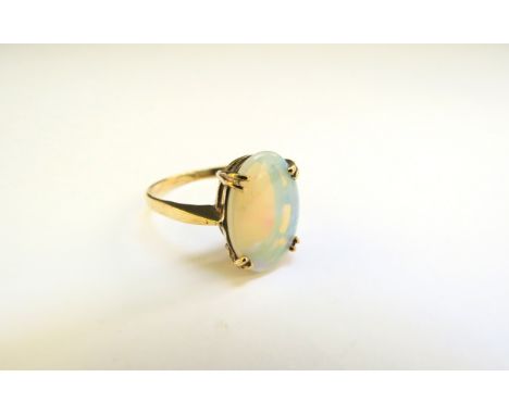 A 9ct gold oval opal ring. Size Q/R, 2.5g 