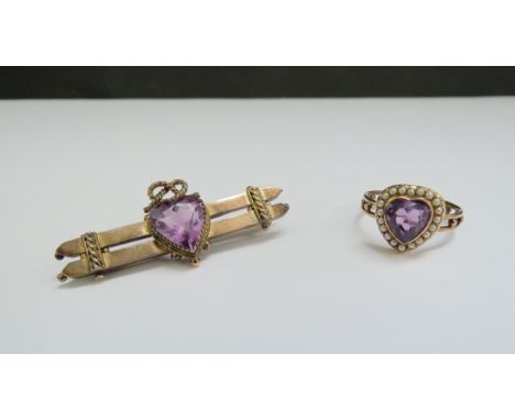 An amethyst and seed pearl ring as a heart. Size O, and a similar bar brooch with amethyst coloured heart to centre, stamped 