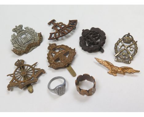 Cap badges, collars etc inc 1915 Suffolk VTC collar with Gaunt plaque, plastic ATS, Trench Art rings, etc (9)