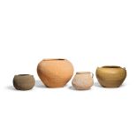 FOUR EARLY POTTERY VESSELS WITH COMBED DECORATION Warring States/Han Dynasty (4)
