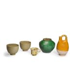 AN AMBER GLAZED FLASK, A SANCAI GLAZED CUP, A GREEN GLAZED JAR AND A PAIR OF CREAM GLAZED BOWLS ...