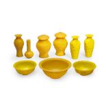 A GROUP OF NINE YELLOW GLASS BOWLS AND VASES 19th/20th century (9)