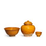 AN AMBER-GLAZED JAR AND A COVER, AN AMBER-GLAZED BOWL AND AN AMBER GLAZED CUP Sui/Tang Dynasty (4)