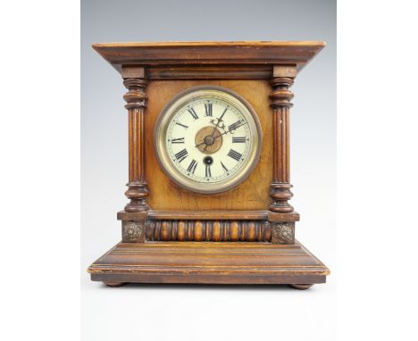 A German Walnut mantle clock, 26 cm x 16 cm x 27 cm,(running when catalogued),accuracy and reliability untested