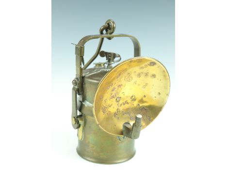 An early to mid 20th Century brass carbide lantern, having an external jet and removable reflector, 12 x 13 x 20 cm excluding