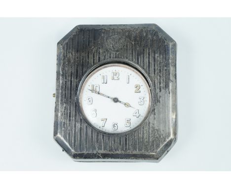 An early 20th Century silver fronted Goliath watch holder, having an engine turned front bearing a monogram, [lacking back-st