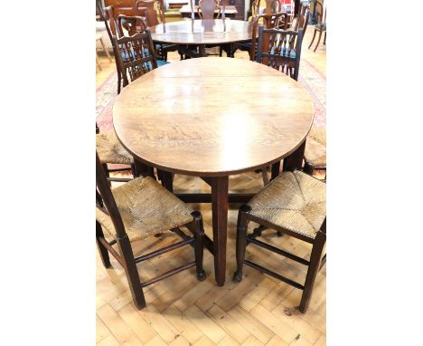 A late 19th / early 20th Century oak gate-leg dining table, 110 cm x 168 cm x 75 cm