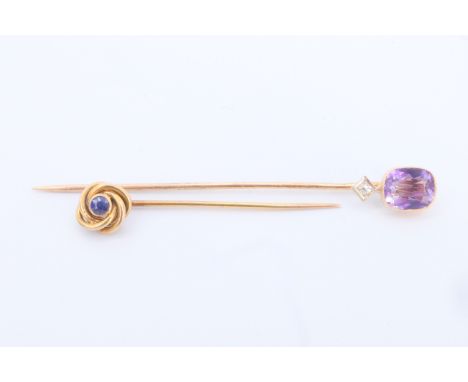 A Belle Epoque amethyst, diamond and yellow metal stick pin together with a sapphire and yellow metal stick pin