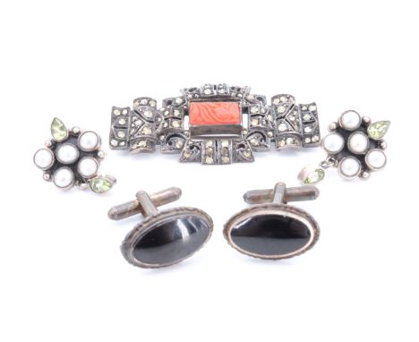 A vintage Art Deco style carved coral, marcasite and white metal brooch, a pair of peridot and pearl earrings and a pair of c
