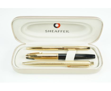 A cased Sheaffer 770 cartridge fountain pen, having 14 K nib, and two Sheaffer ball point pens