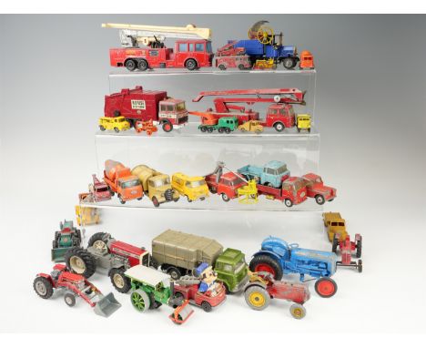 A group of vintage play-worn diecast tractors, cranes and other work vehicles, including Corgi, Dinky, etc