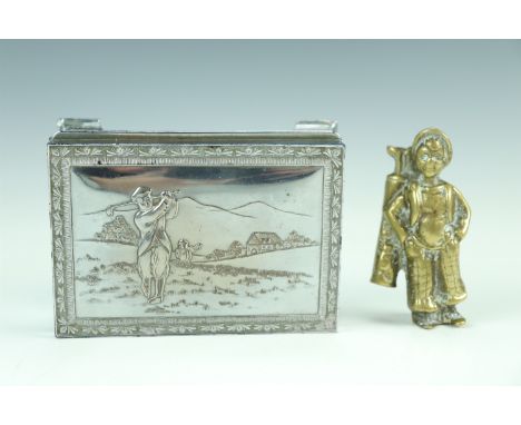 A electroplated table cigarette box depicting a golfer, together with a brass mascot of a caddy, 12 cm