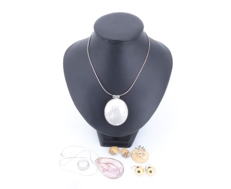 A group of contemporary white metal jewellery including two mother-of-pearl pendant necklaces and a demi-parure
