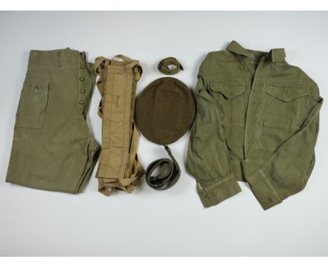 A quantity of early post-War British army clothing and equipment including a 1950s denim overall blouse and trousers, ground 