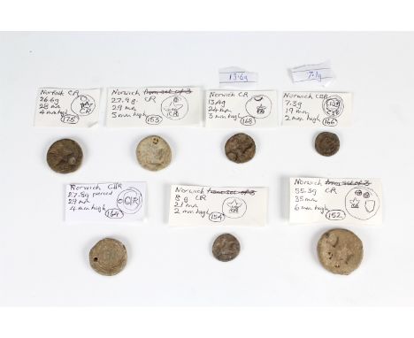 Seven Charles I and II lead trade weights relating to Norwich, variously marked with a crowned 'CR', crowned 'C II R' and an 