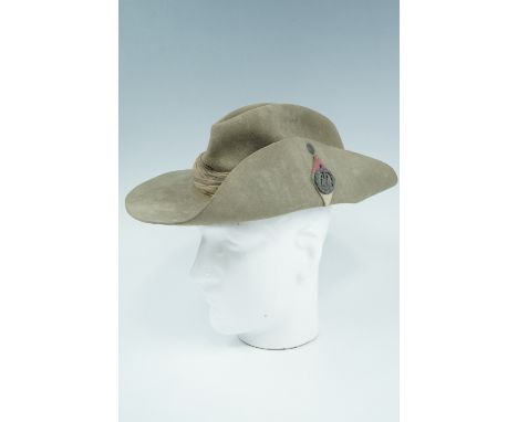 A 1943 British army slouch hat bearing a Dorsetshire Regiment badges and backing