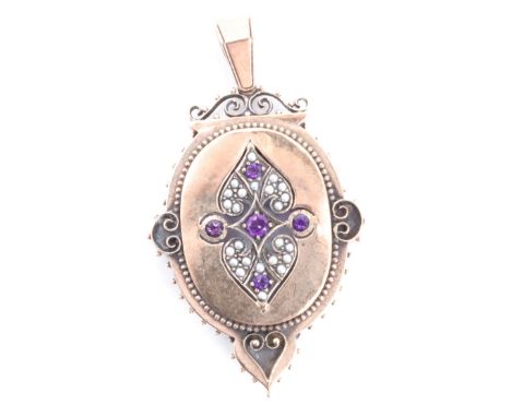 A Victorian 9 ct gold, amethyst and seed pearl pendant, of oval form with scroll and pellet ornament, 63 mm including suspend