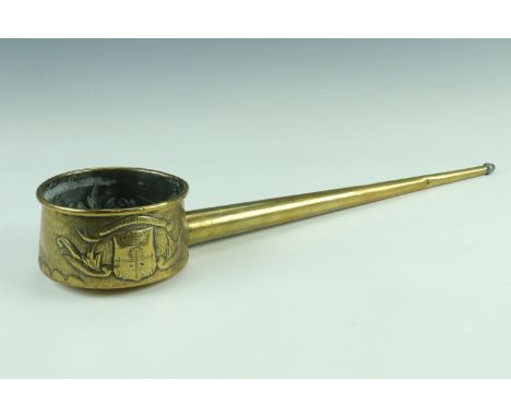 A French brass hollow handled wine or similar ladle, manufactured at and bearing the arms of Pau, South of France, circa 1930