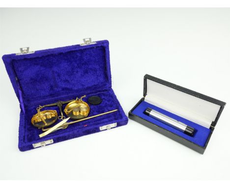 A modern set of jeweler's balance scales and a cased spectroscope