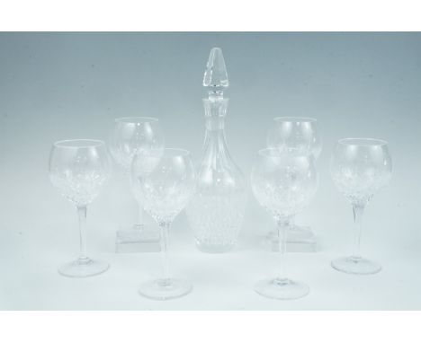 A Stuart Crystal decanter together with six large wine glasses, 21 cm