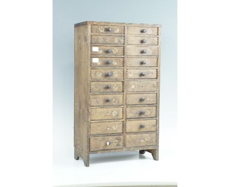 A set of watchmaker's pine watch glass drawers containing a large quantity of vintage watch glasses