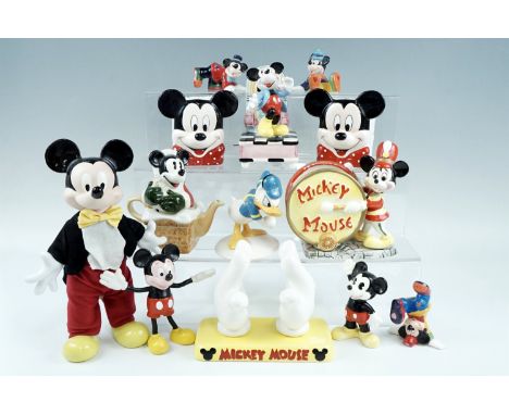 A group of vintage Disney ceramics, including a Royal Doulton "Donald Duck MM 3", a Mickey Mouse doll, a "Mickey Santa" teapo