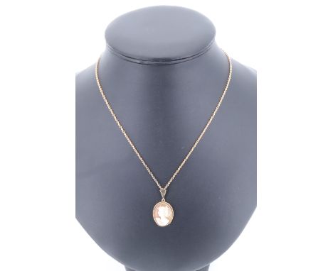A yellow metal chain, marked "9ct", with a vintage yellow metal shell cameo pendant, bail marked "9ct", overall 5.37 g