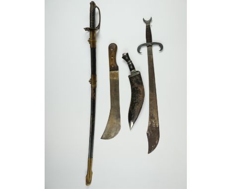 A reproduction American Civil War Confederate sword, a Toledo decorative sword, a machete and a kukri