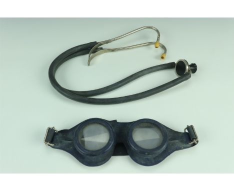 A set of vintage Typhoon swimming goggles together with a medical stethoscope