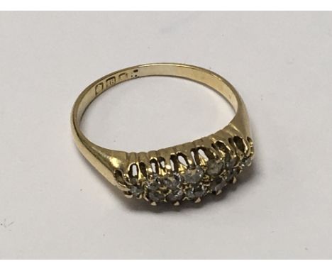 An 18ct gold ring inset with two rows of small diamonds. Weight 3g