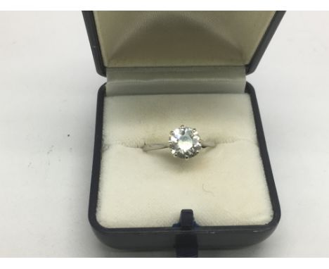 A platinum diamond ring set with a round brilliant cut diamond, approx 1.72ct, colour J, clarity S12. Approx weight 2.7g and 