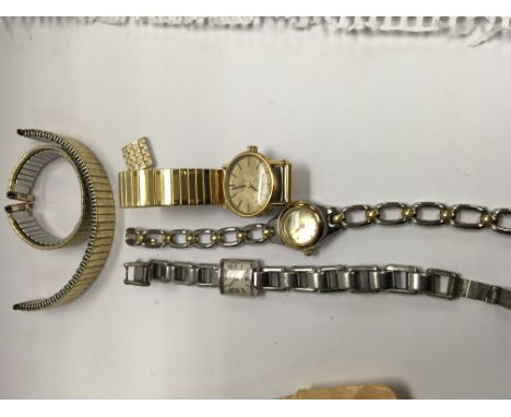 Three ladies wrist watches including omega Movado and Quartz with extra straps