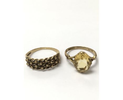 Two 9ct gold rings, one keeper ring and one citrine ring. The keeper ring is approximately ring size R and weighs approximate