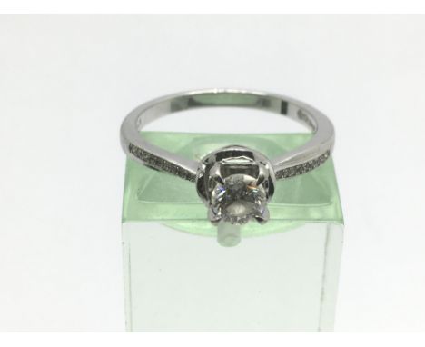 A 14ct white gold modern design ring set with a brilliant cut diamond, approx 0.4ct, colour G-H, clarity SI-1. The shank is s