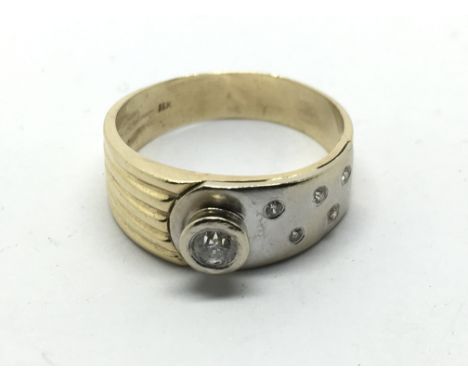 A 14k yellow and white gold ring set with diamonds, approx 4.8g and approx size R-S.