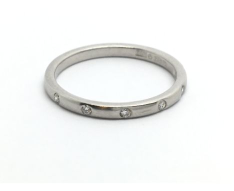 A platinum five stone half eternity diamond ring, approx .10ct, approx 2.6g and approx size K.