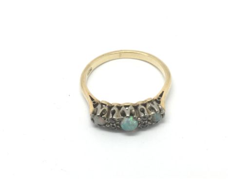 An 18ct gold, opal and diamond ring, approx 4.4g and approx size R-S.