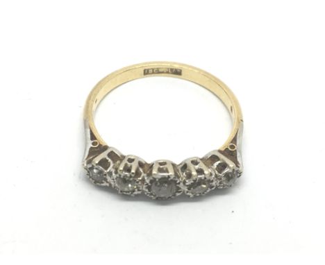 A platinum and 18ct gold ring set with a row of five old cut diamonds, approx 4g and approx size S-T.