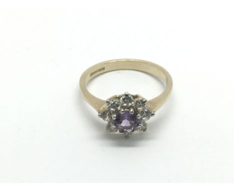A 9ct gold ring set with amethyst and CZs, approx 3g and approx size P.