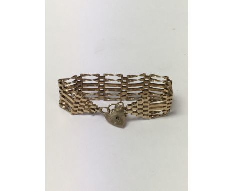 A 9ct gold gate bracelet secured with a padlock.