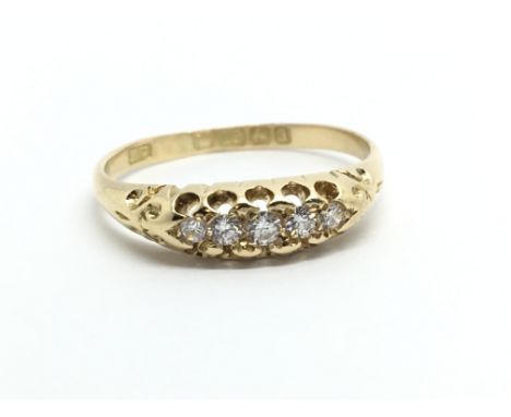 A vintage 18ct gold five stone diamond ring, approx 2.7g and approx size O.