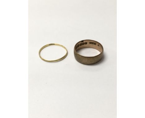 A 9ct gold wedding ring approximately between size n - o and weighing 3.3g. Also one smaller gold ring weighing approximately